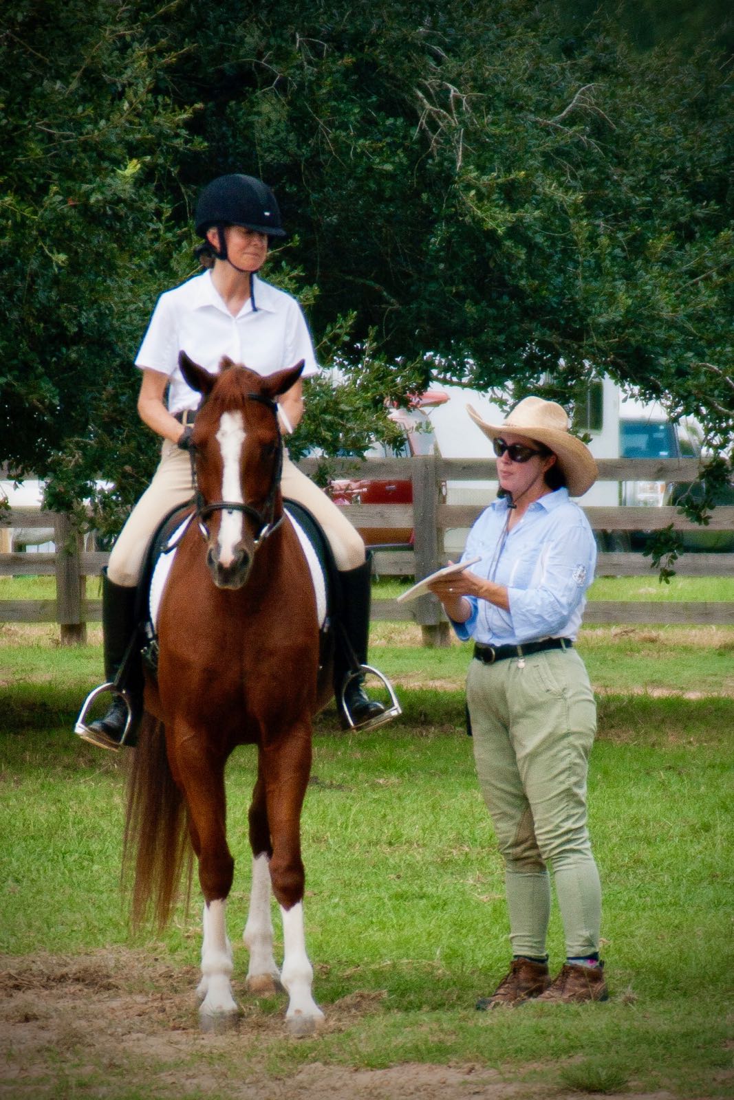 Instructor teaching a riding lesson